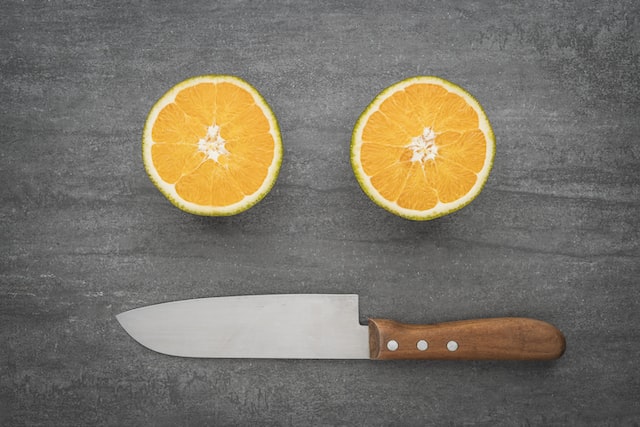 kitchen knife with oranges